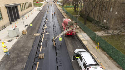 Coils that charge electric vehicles as they travel over the road are placed beneath a layer of asphalt. (Courtesy of MDOT Photo Services)