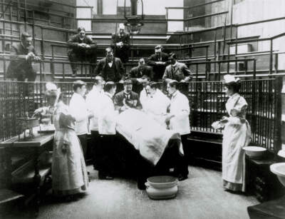 Medical students stand around an operation in a lecture theater in the United Kingdom around 1898. (SSPL/Getty Images)
