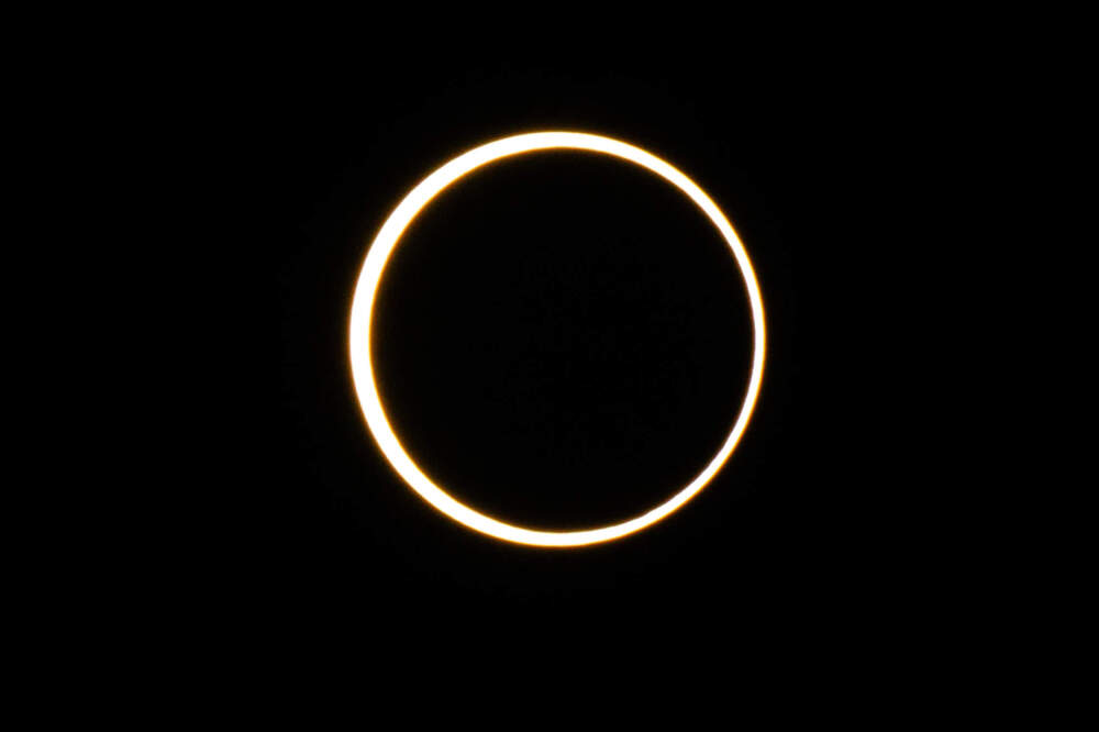 The moon descends over the sun's horizon during an annular solar eclipse on Oct. 14, 2023 in Kerrville, Texas. Differing from a total solar eclipse, the moon in an annular solar eclipse covers part of the sun's light, creating the &quot;ring of fire&quot; effect around the moon. (Brandon Bell/Getty Images)