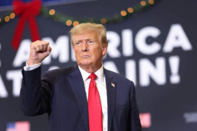 Republican presidential candidate and former U.S. President Donald Trump gestures as he wraps up a campaign event on December 19, 2023 in Waterloo, Iowa. (Scott Olson/Getty Images)