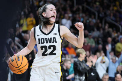 Caitlin Clark #22 of the Iowa Hawkeyes celebrates after beating the LSU Tigers 94-87 in the Elite 8 round of the NCAA Women's Basketball Tournament at MVP Arena on April 01, 2024 in Albany, New York. (Andy Lyons/Getty Images)