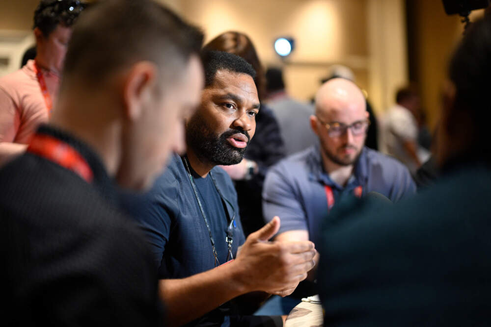 New England Patriots head coach Jerod Mayo, center, talks with reporters during an AFC coaches availability at the NFL owners meetings, Monday, March 25, 2024, in Orlando, Fla. (Phelan M. Ebenhack/AP)