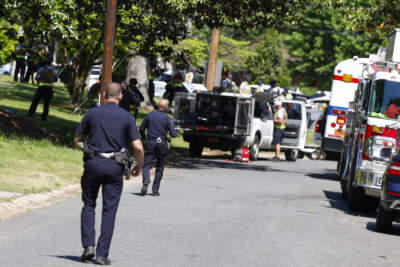 Charlotte Mecklenburg Police Department officers walk in the neighborhood where a shooting took place in Charlotte, N.C., Monday, April 29, 2024. (Nell Redmond/AP)