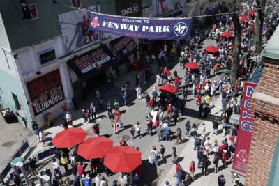 Fans outside Fenway Park before an home opener baseball game in 2022. (Michael Dwyer/AP)