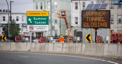Signs near the Sumner Tunnel entrance warn drivers of tunnel closures in 2023. The Sumner Tunnel will close again for one month in 2024. (Robin Lubbock/WBUR)