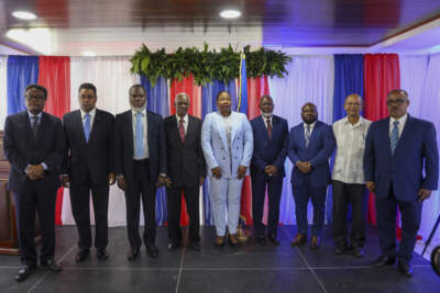 Haiti's Transitional Council members, from left to right; Fritz Alphonse Jean, Laurent Saint-Cyr, Frinel Joseph, Edgard Leblanc Fils, Regine Abraham, Emmanuel Vertilaire, Smith Augustin, Leslie Voltaire and Louis Gerald Gilles, pose for a group photo after a ceremony to name its president and a prime minister in Port-au-Prince, Haiti, Tuesday, April 30, 2024. Fils was chosen as the president of the panel. (Odelyn Joseph/AP)