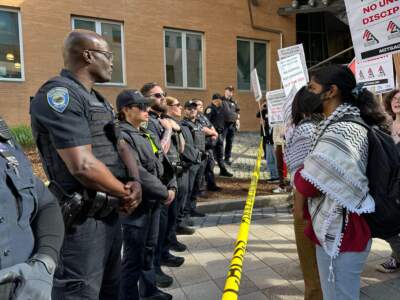 Police and pro-Palestinian protesters face each other at MIT on Thursday afternoon. (Jesse Costa/WBUR)