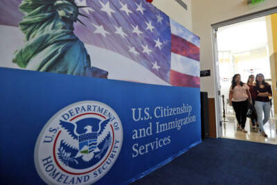 People arrive before the start of a naturalization ceremony at the U.S. Citizenship and Immigration Services Miami Field Office in Miami. (Wilfredo Lee/AP)