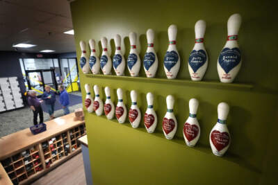 Bowling pins labeled for each of the 18 victims of the Oct. 25, 2023, mass shooting are displayed at Just In Time Recreation, Wednesday, May 1, 2024, in Lewiston, Maine.