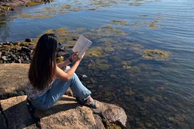 The author, reading a book near Acadia National Park in Maine. (Courtesy Kristin T. Lee)
