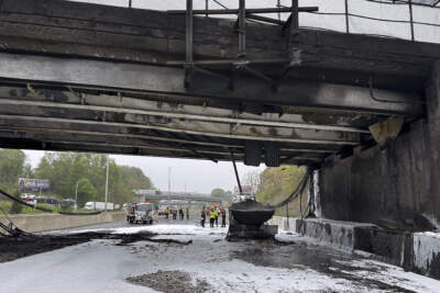In this image provided by the Connecticut Governor's Office, emergency personnel work at the scene of a fiery crash that left both sides of Interstate 95, the East Coast’s main north-south highway on Thursday in Norwalk, Conn. (Norwalk Fire Department/Connecticut Governor's Office via AP)